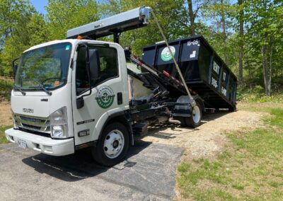 dumpster being picked up angle 2